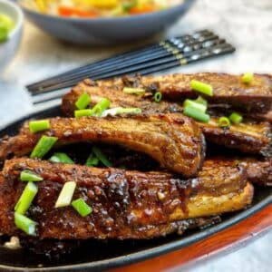 Close up of pork spareribs on a plate.