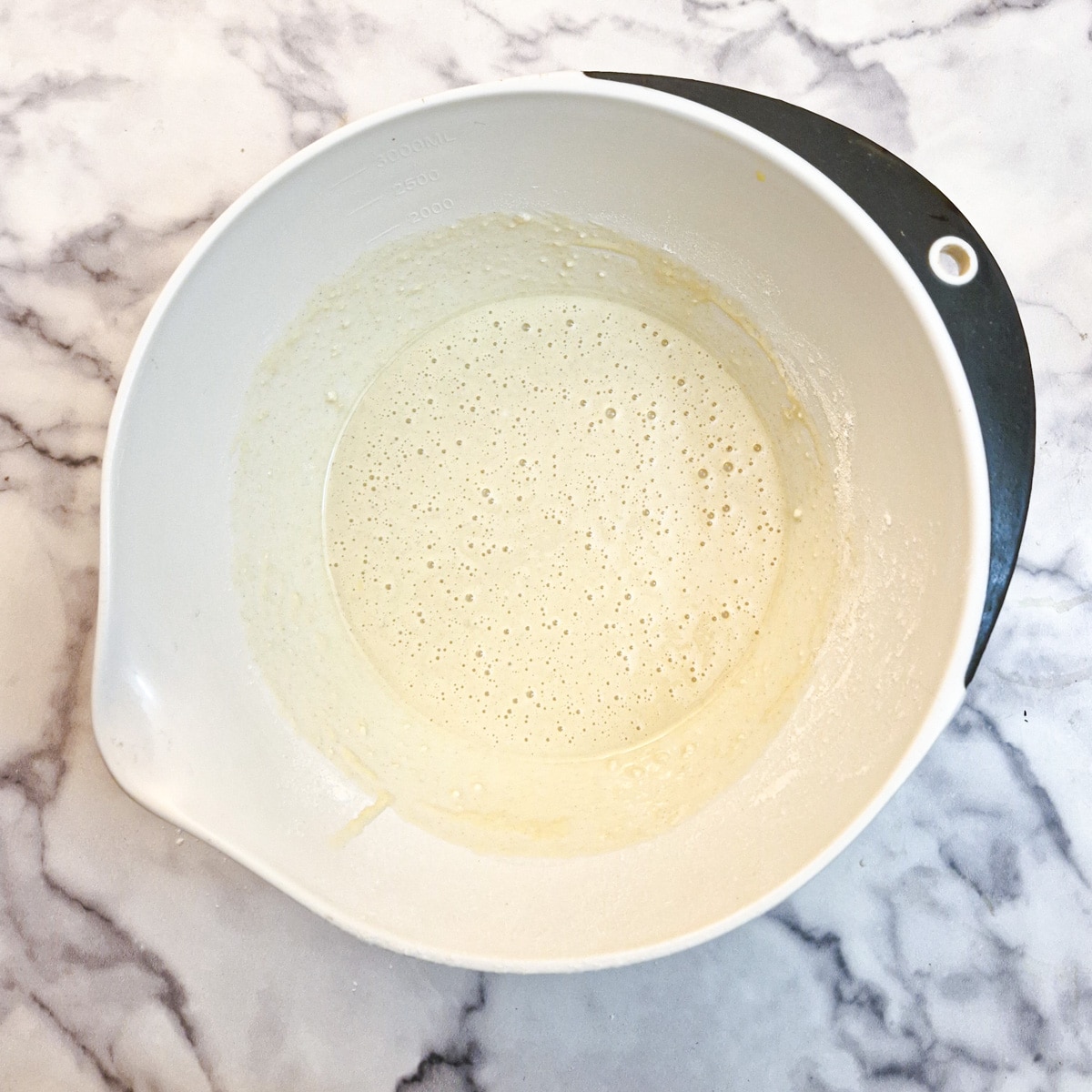 Mixed drop scone batter in a mixing bowl.