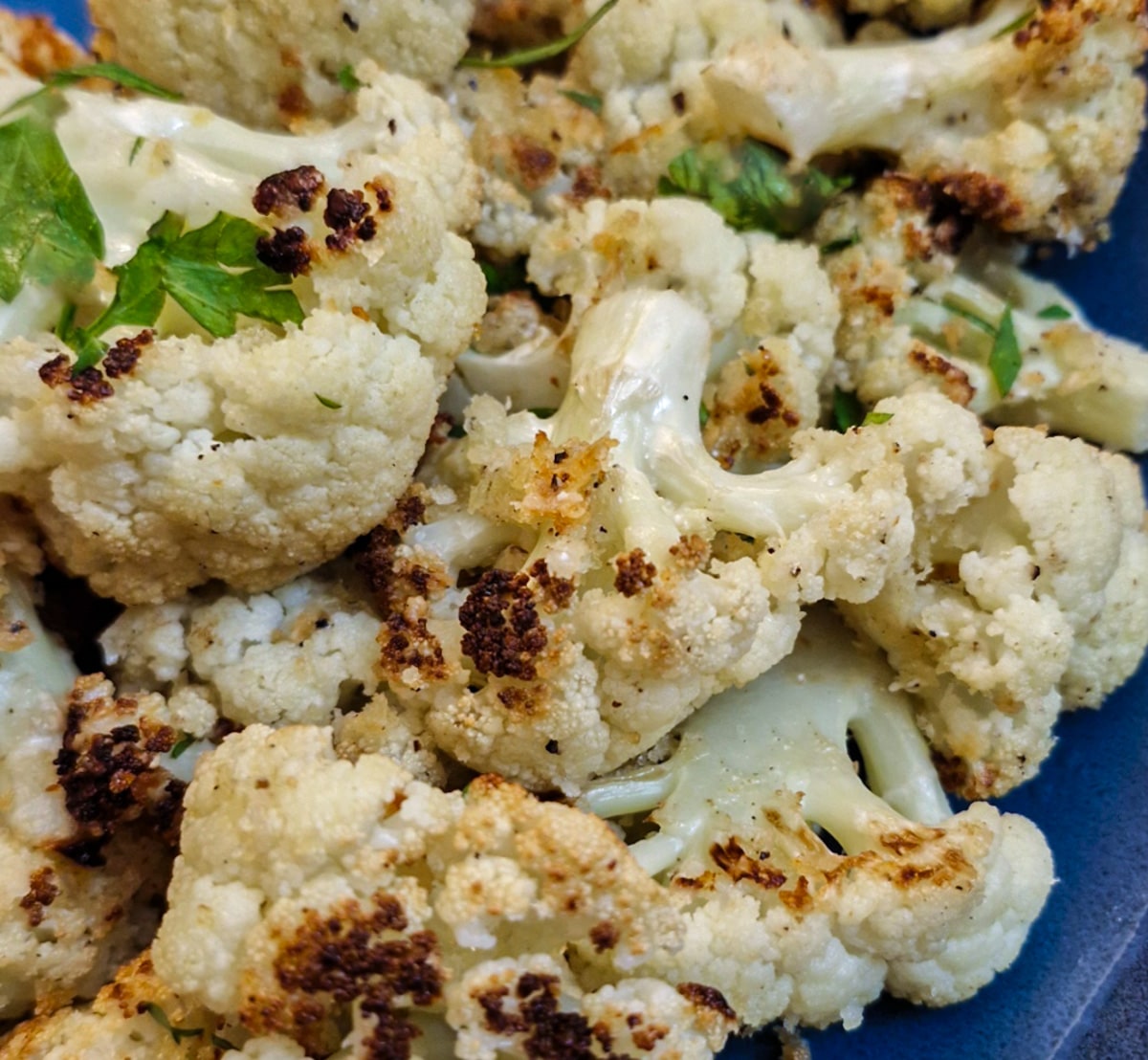 Closeup of roasted parmesan cauliflower florets.