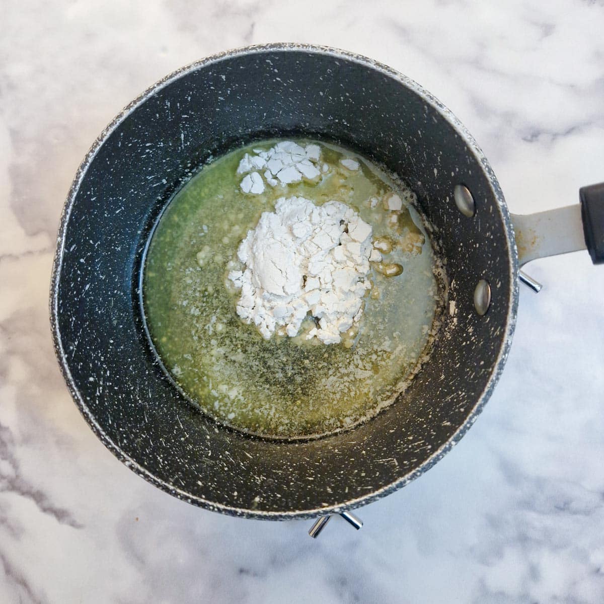 Melted butter and flour in a saucepan.