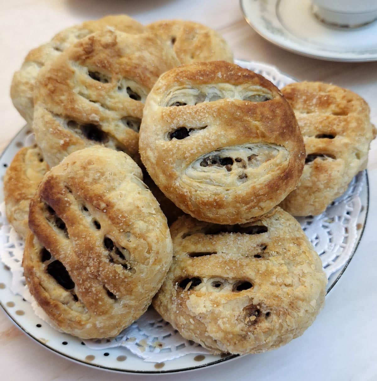 A pile of Eccles cakes on a plate.