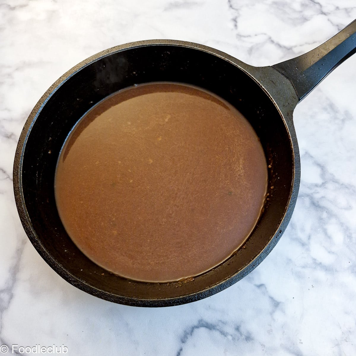 Stock in a frying pan.