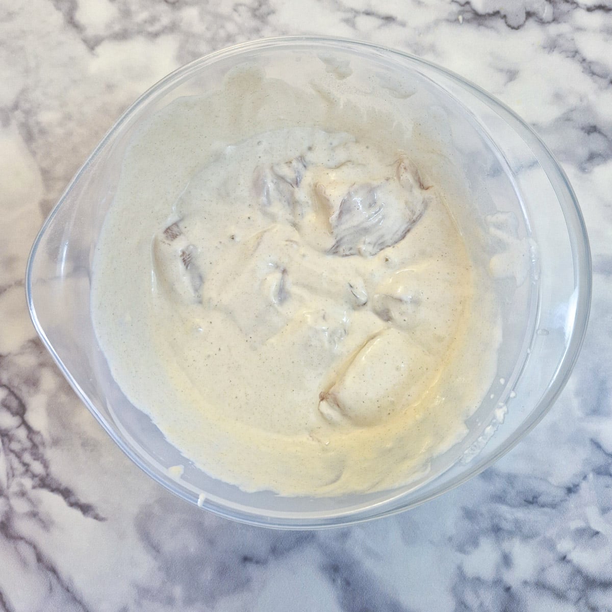Batter mixed with chicken pieces.