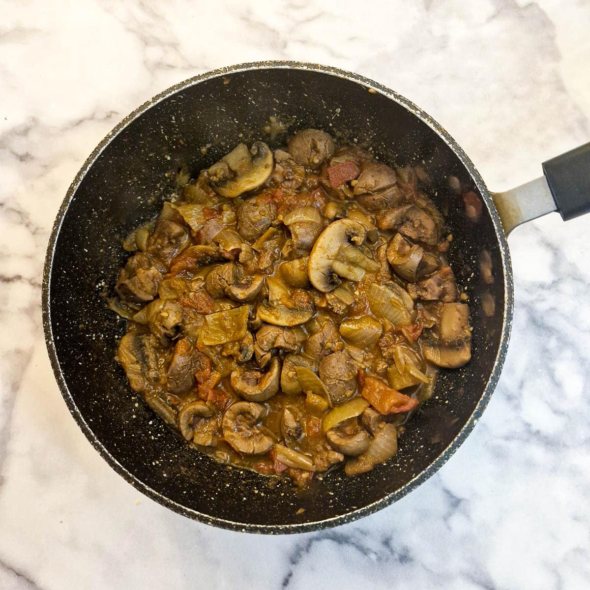 Tomatoes added and cooked.