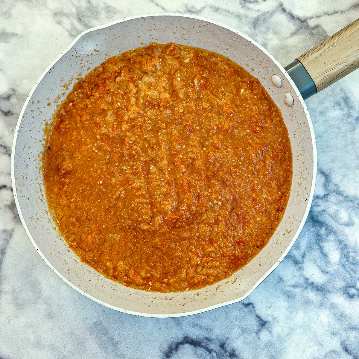 Passata added to cooked peppers and onions.