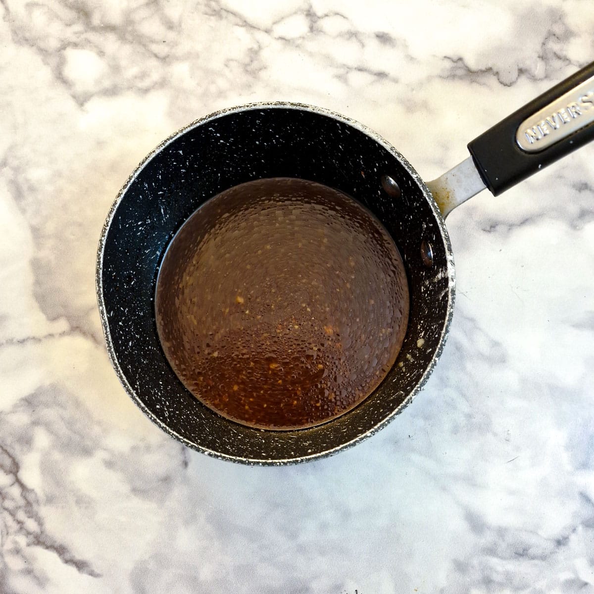 Teriyaki sauce ingredients in a small saucepan.
