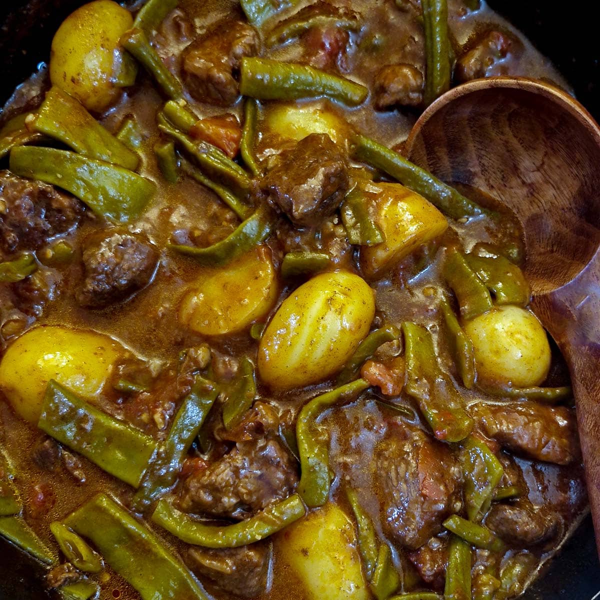 Close up of cooked green bean bredie.