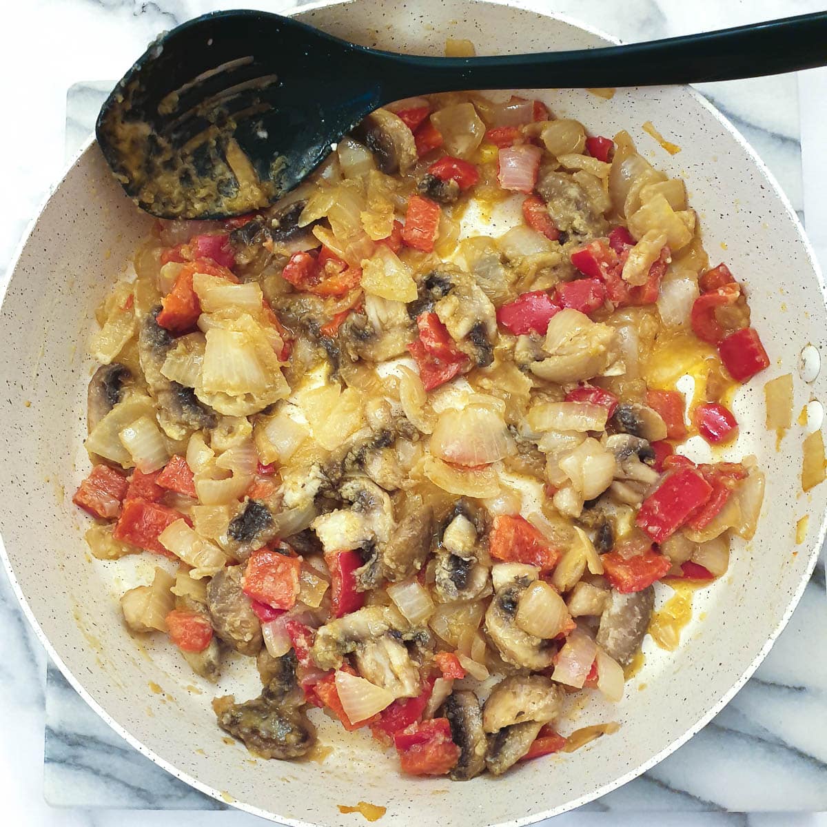 Butter and cornflour mixed into capsicum, onions an mushrooms.