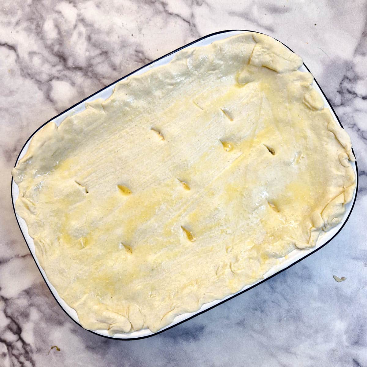 Puff pastry covering the salmon pie.