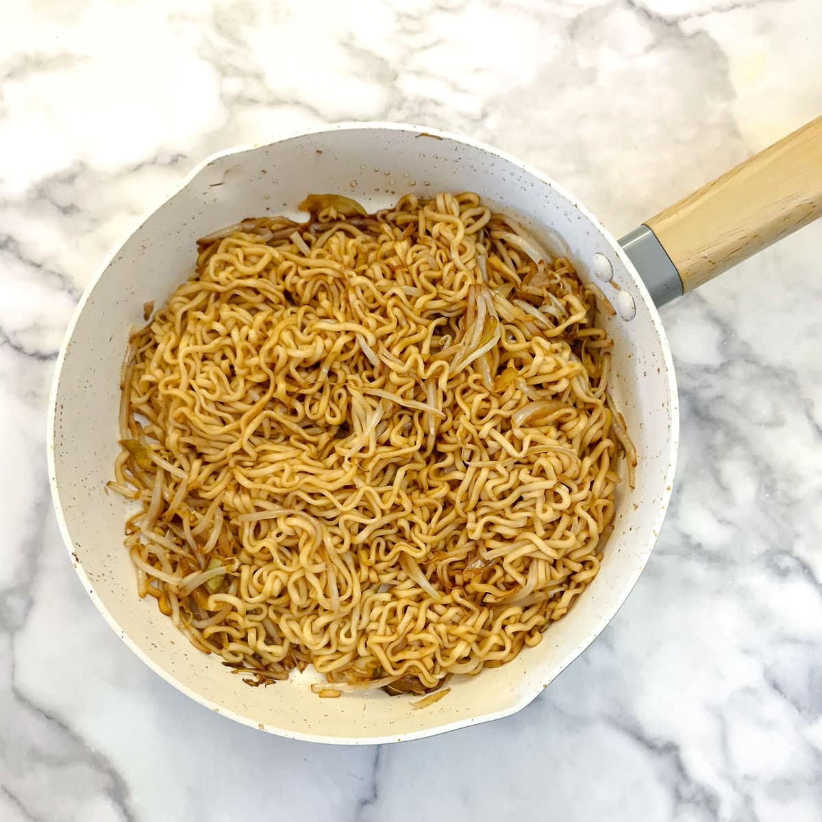 Cooked Chinese stir-fried noodles in a frying pan.