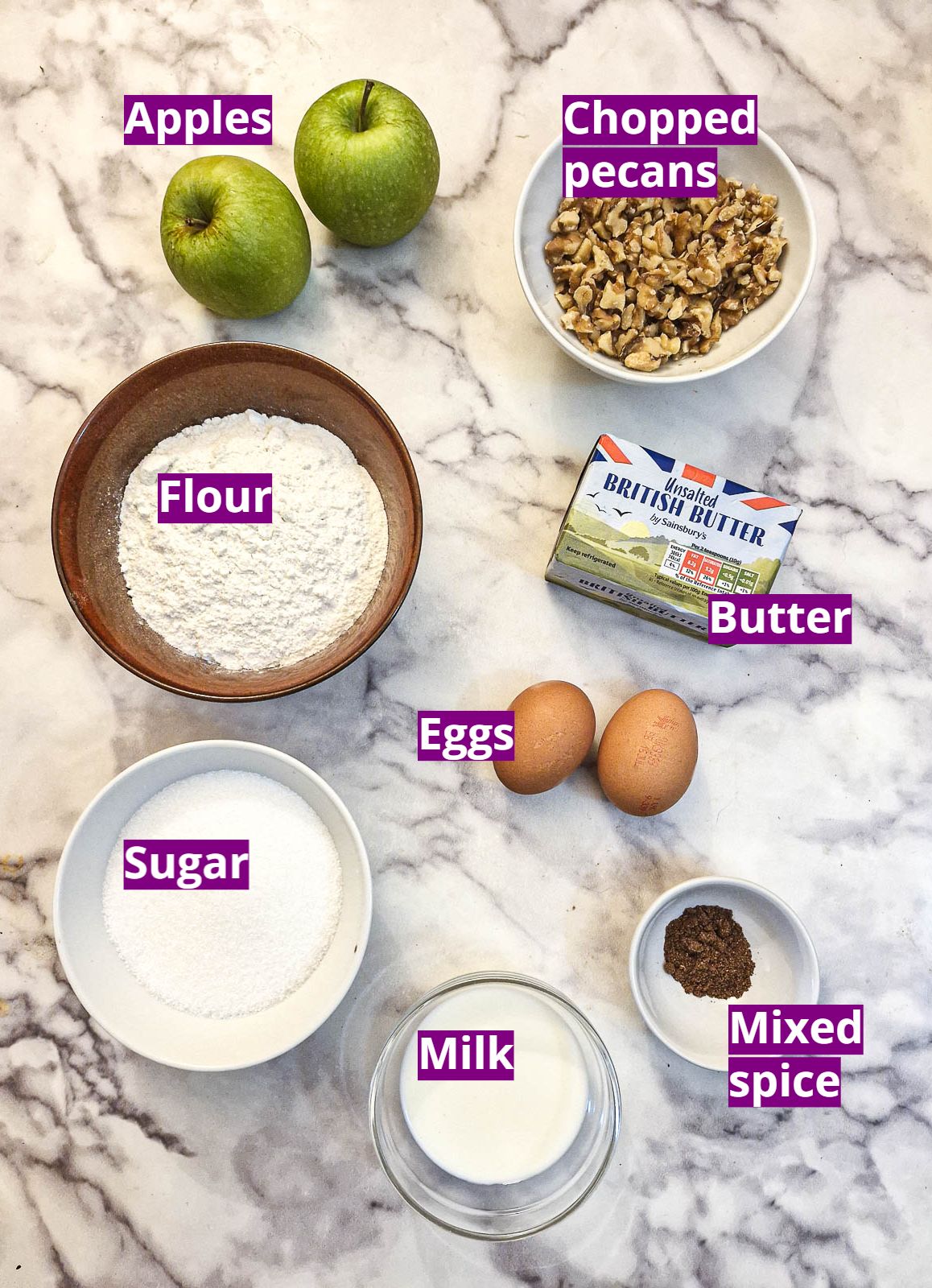 Ingredients for making an apple and pecan nut cake.