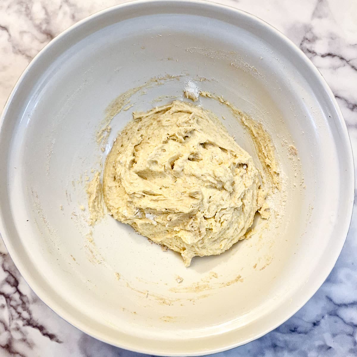 A bowl of cake batter once the flour and milk has been combined.