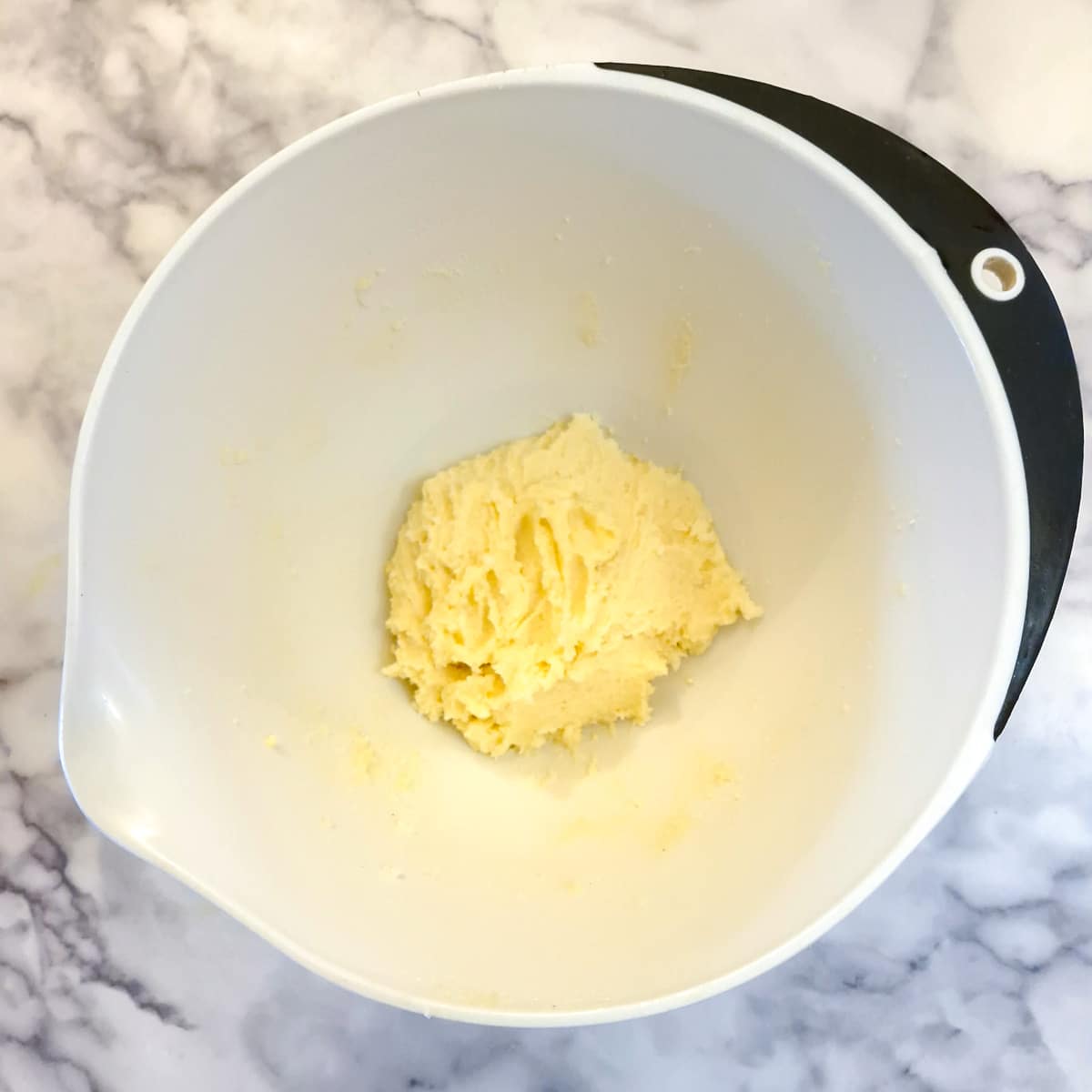Creamed utter and  creamed in a mixing bowl.