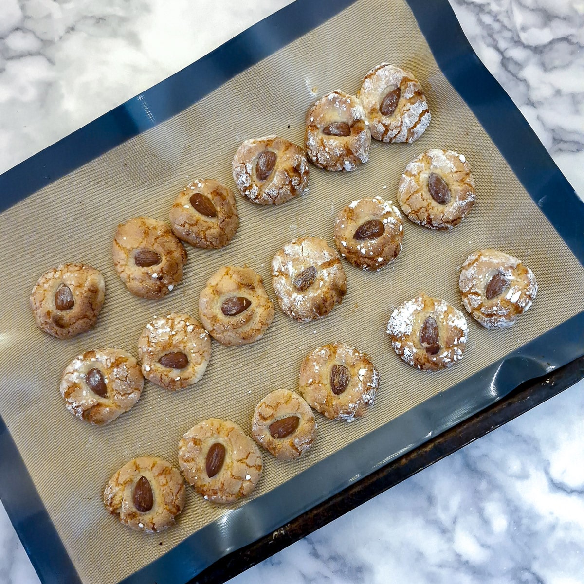 A tray of baked amaretti cookies.