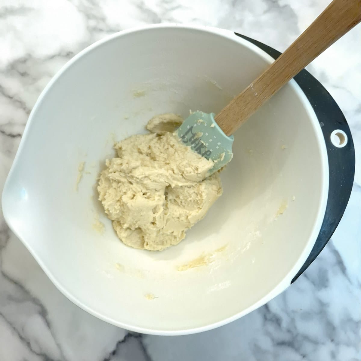 Flour mixed in to form a thick sticky dough.