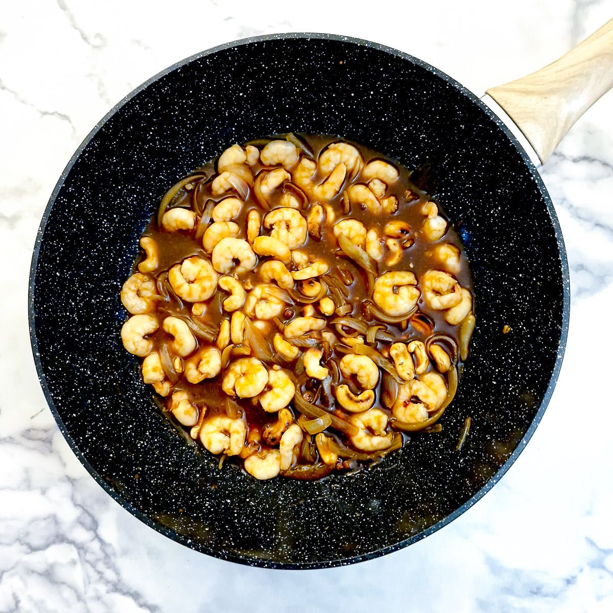 Prawns and cashews added to the sauce.