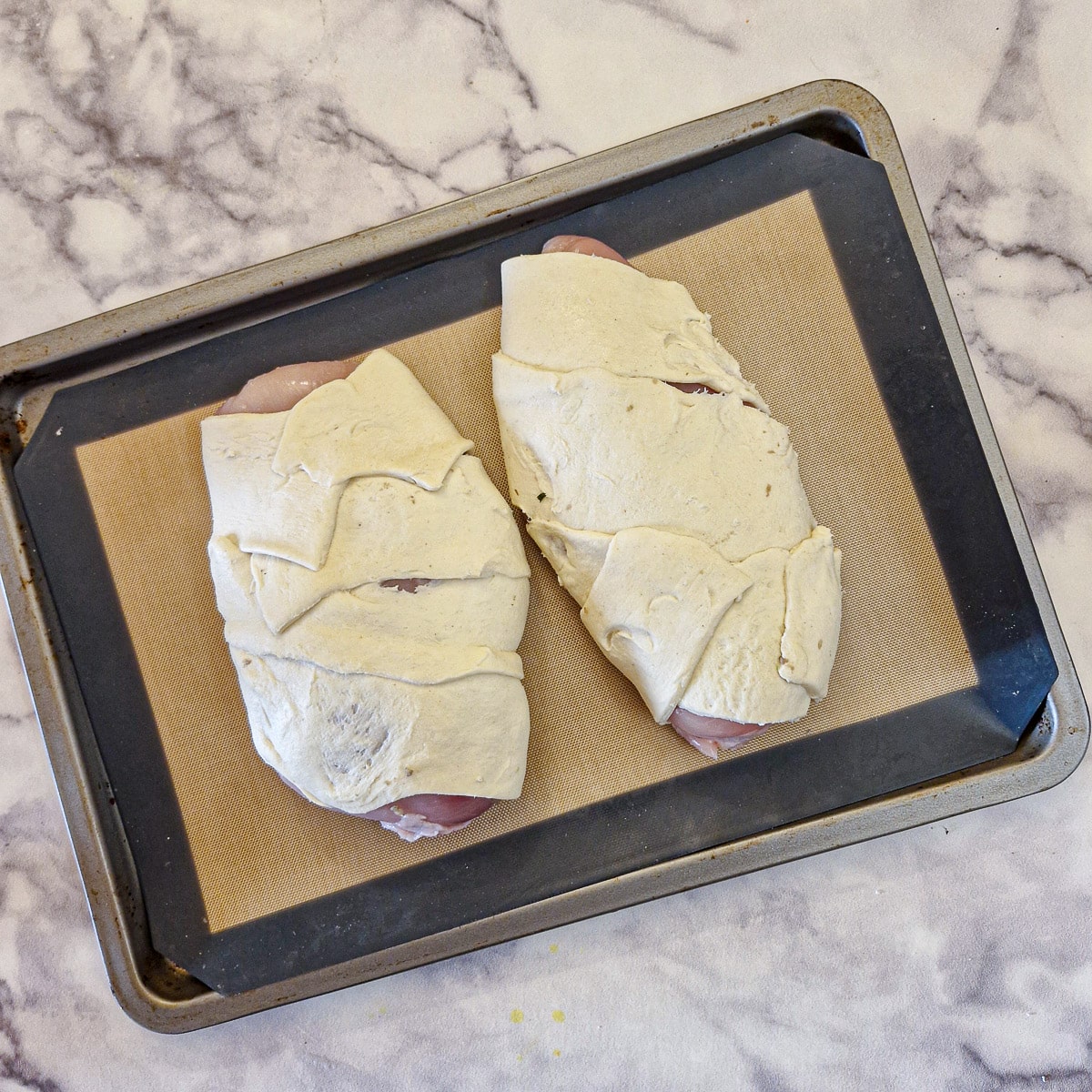 Stuffed chicken breasts wrapped in strips of puff pastry.
