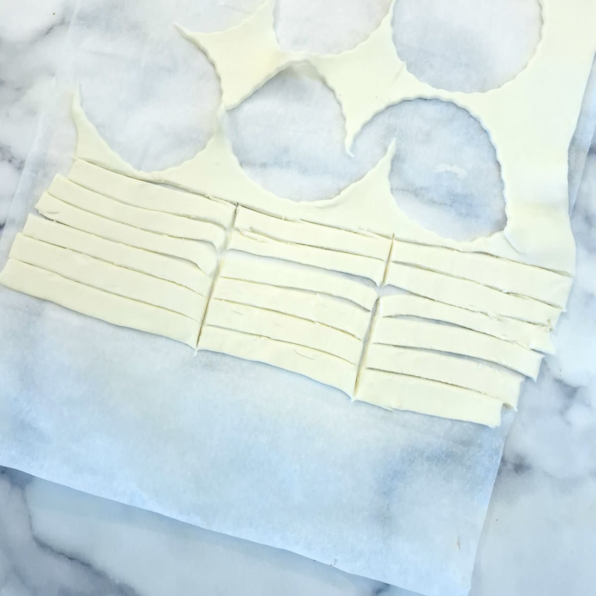 Pastry scraps cut into narrow strips.