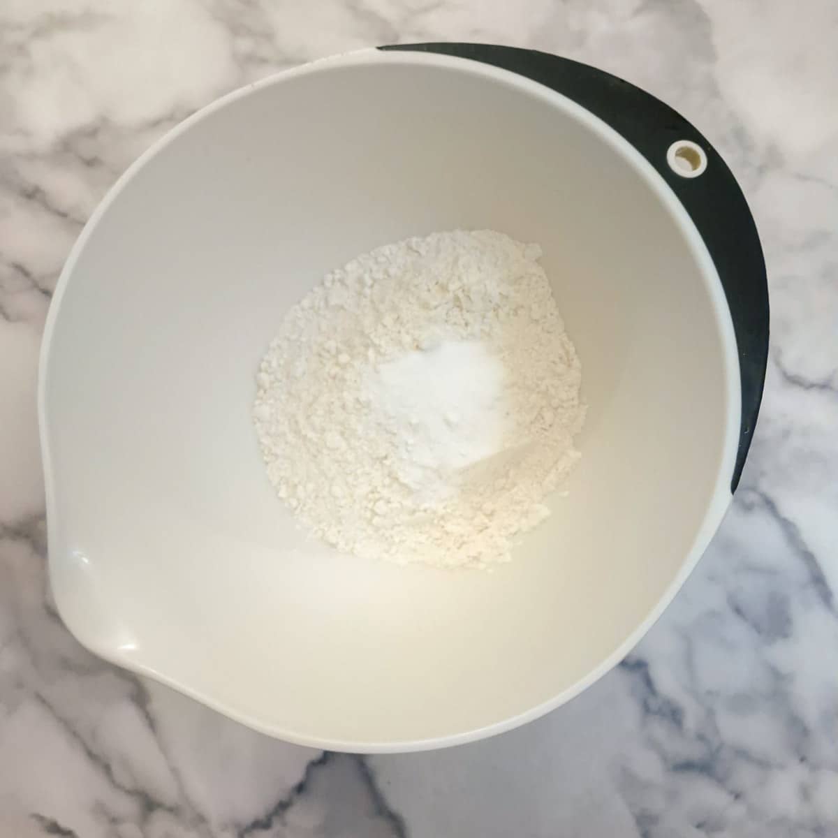 Flour, baking powder and salt in a mixing bowl.