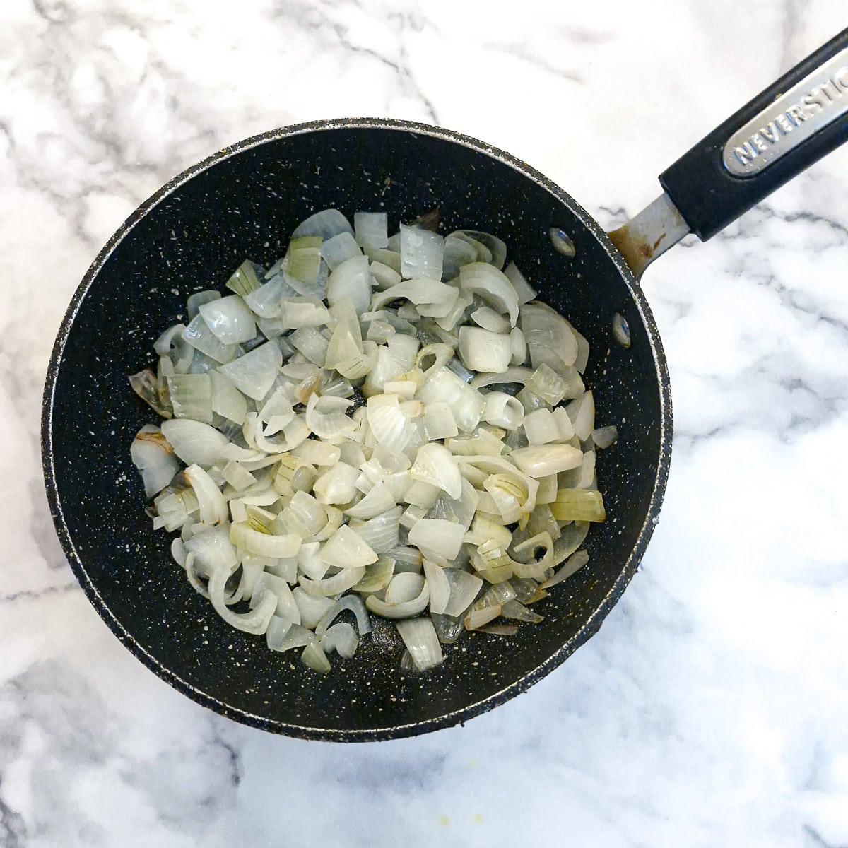 Chopped onions in a saucepan.