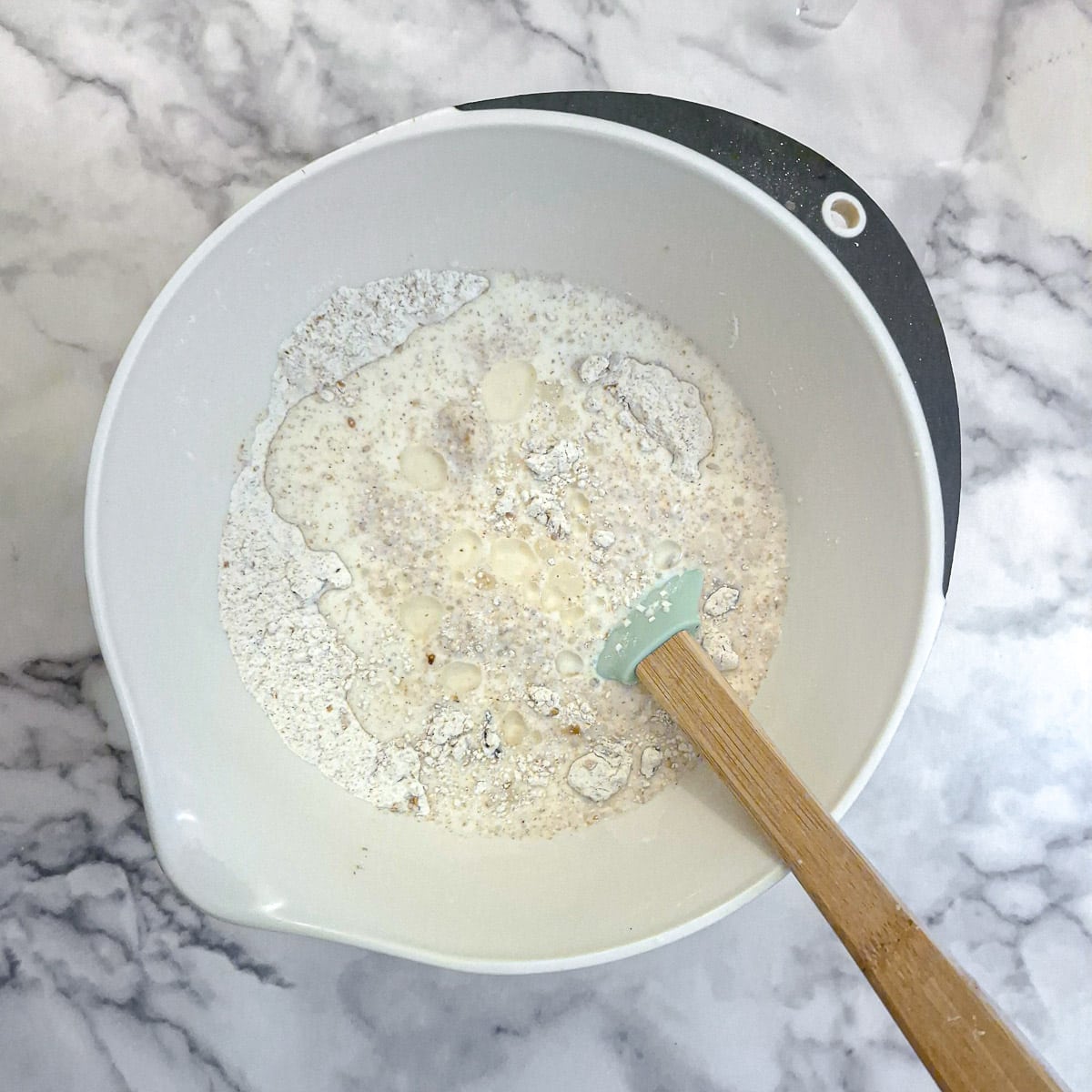 Buttermilk added to the soda bread mixture.