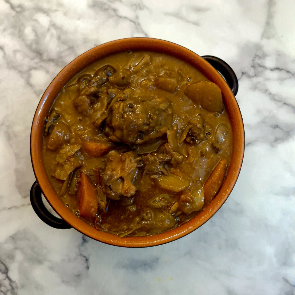 A casserole dish of oxtail stew.