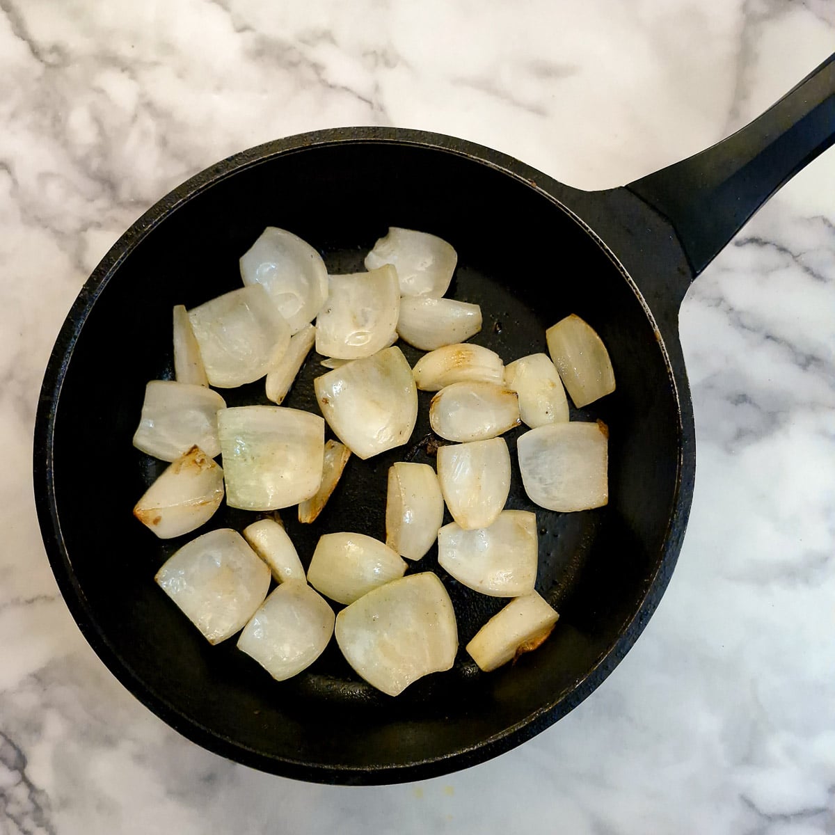 Onions browning in a frying pan