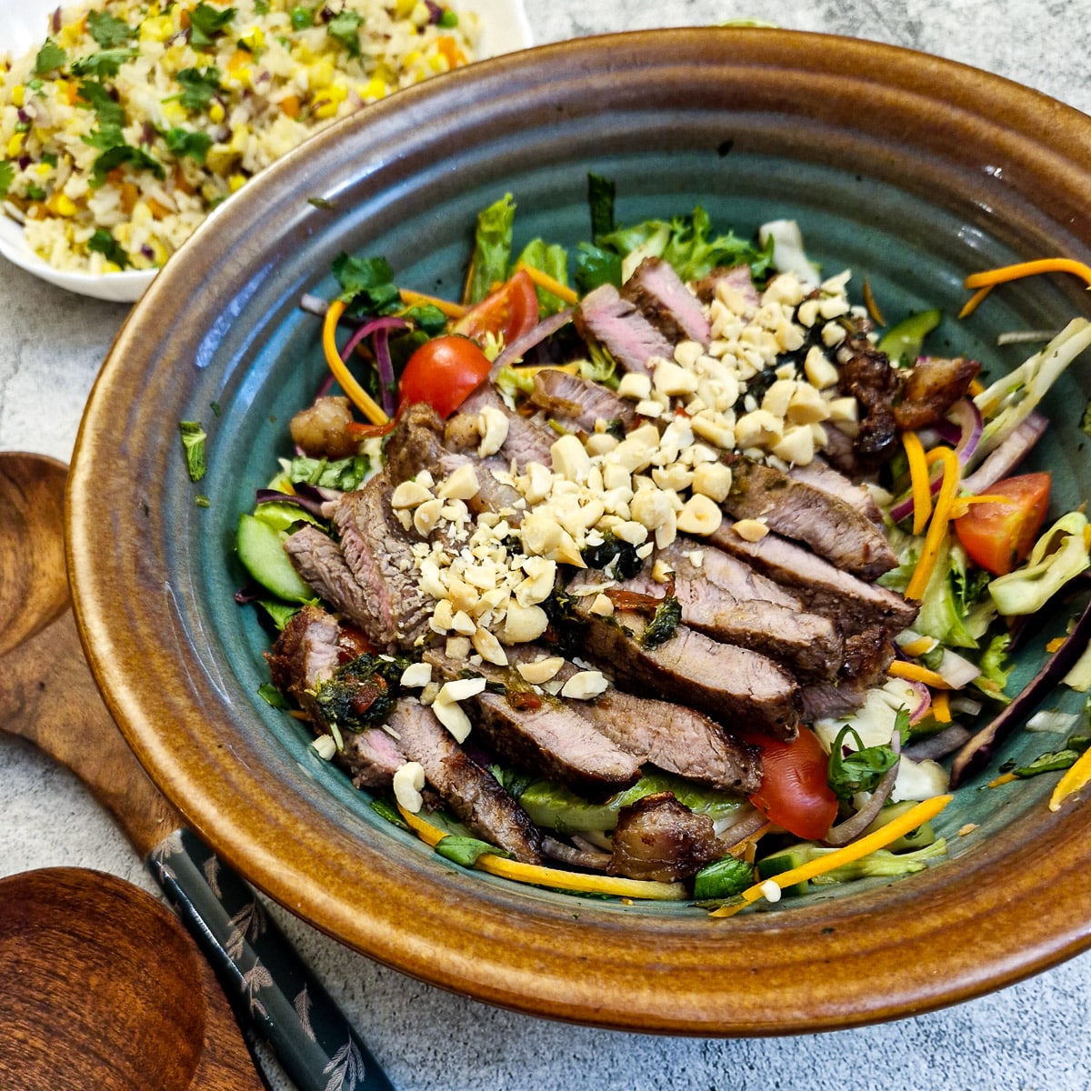 Cllose up of a dish of Thai beef salad.