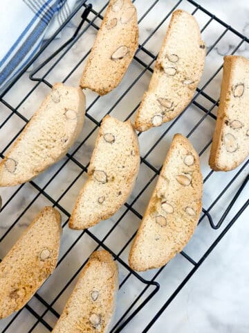 Italian almond biscotti on a cooling rack.