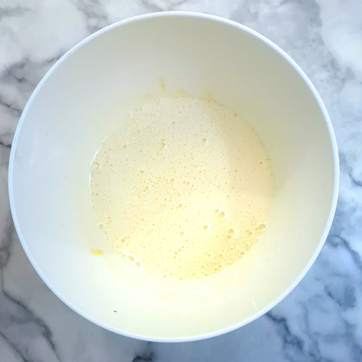 Eggs and sugar whisked together until light and creamy.