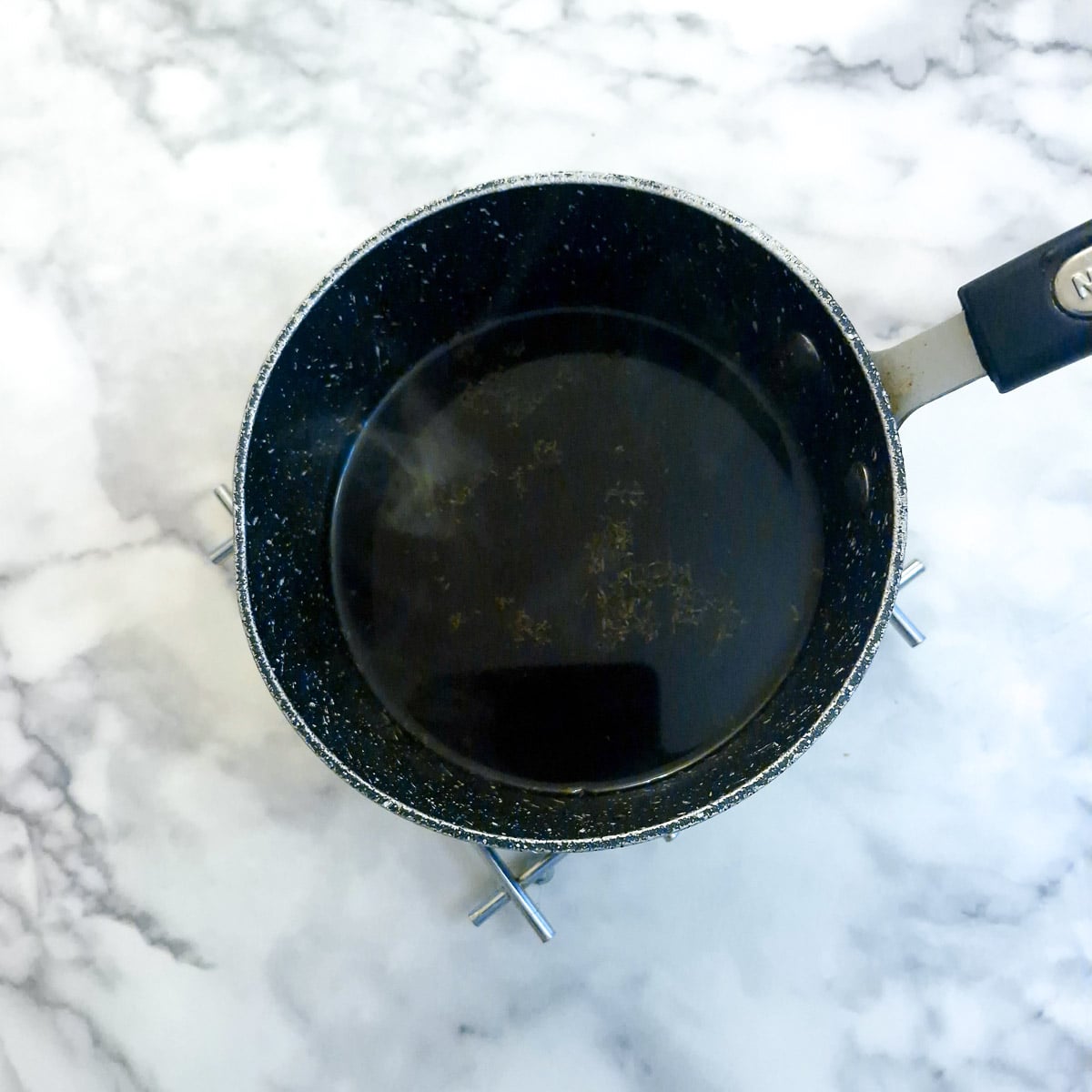 Red wine sauce in a saucepan.