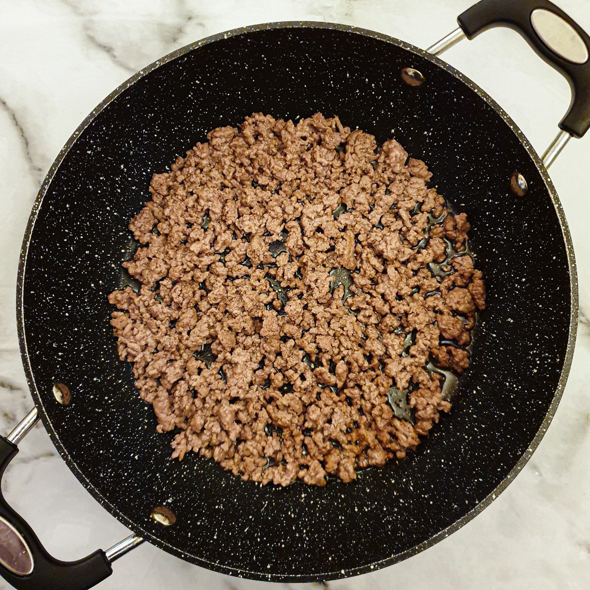 Browned beef mince in a frying pan.