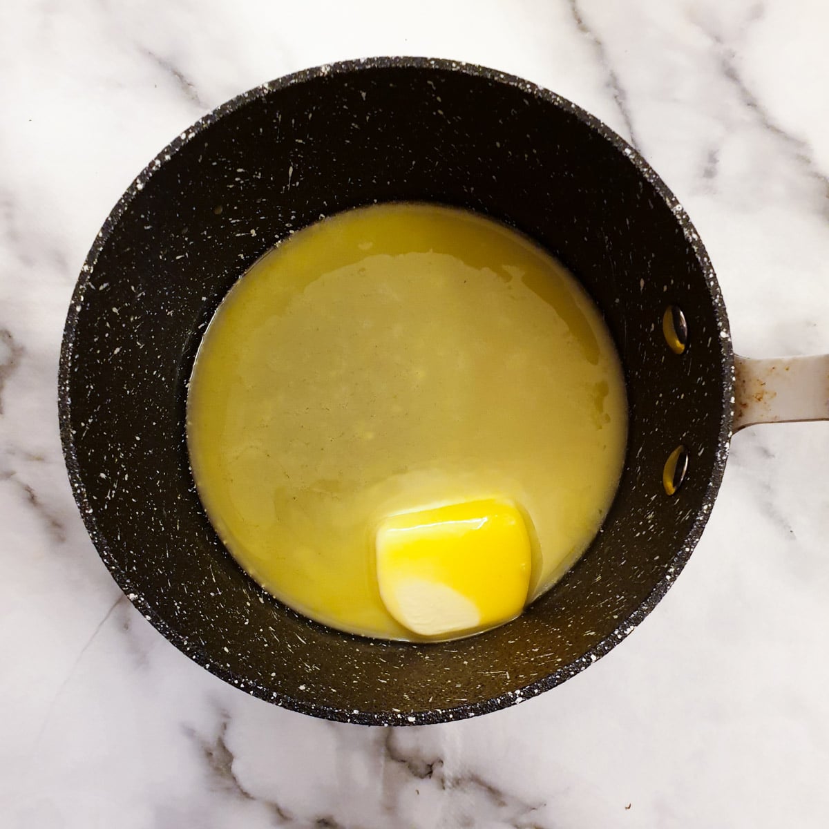 Butter melting in a saucepan.