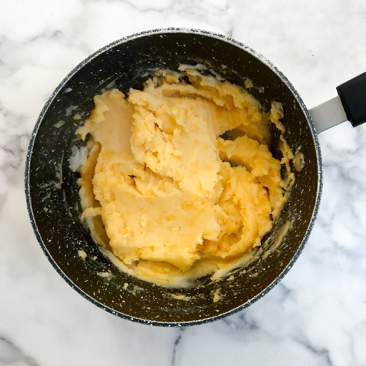 Sweet potato mash in a saucepan.