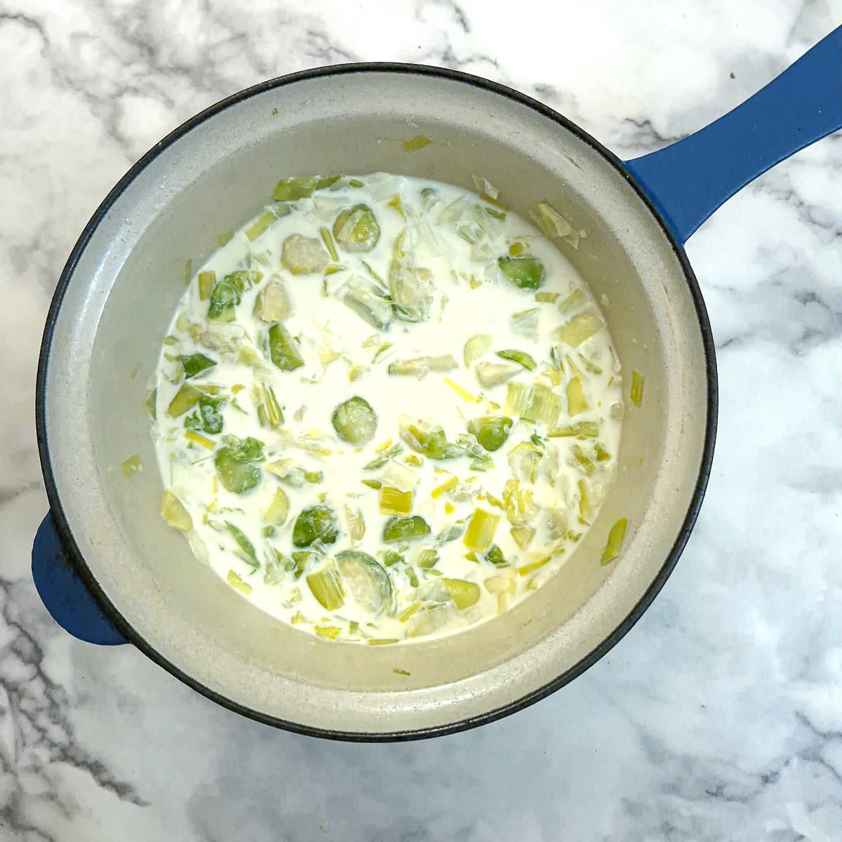 Cream and milk added to the leeks and brussels.