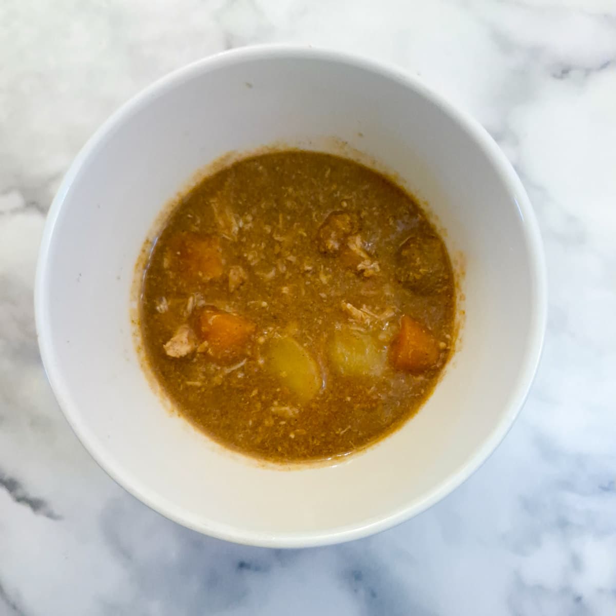 Gravy and vegetables transferred to a small bowl.