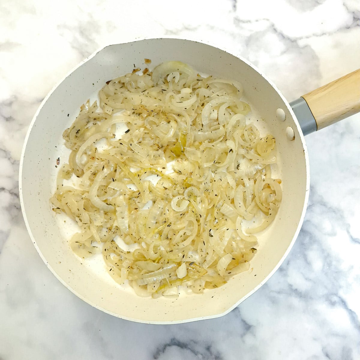 Fried onions in a frying pan.