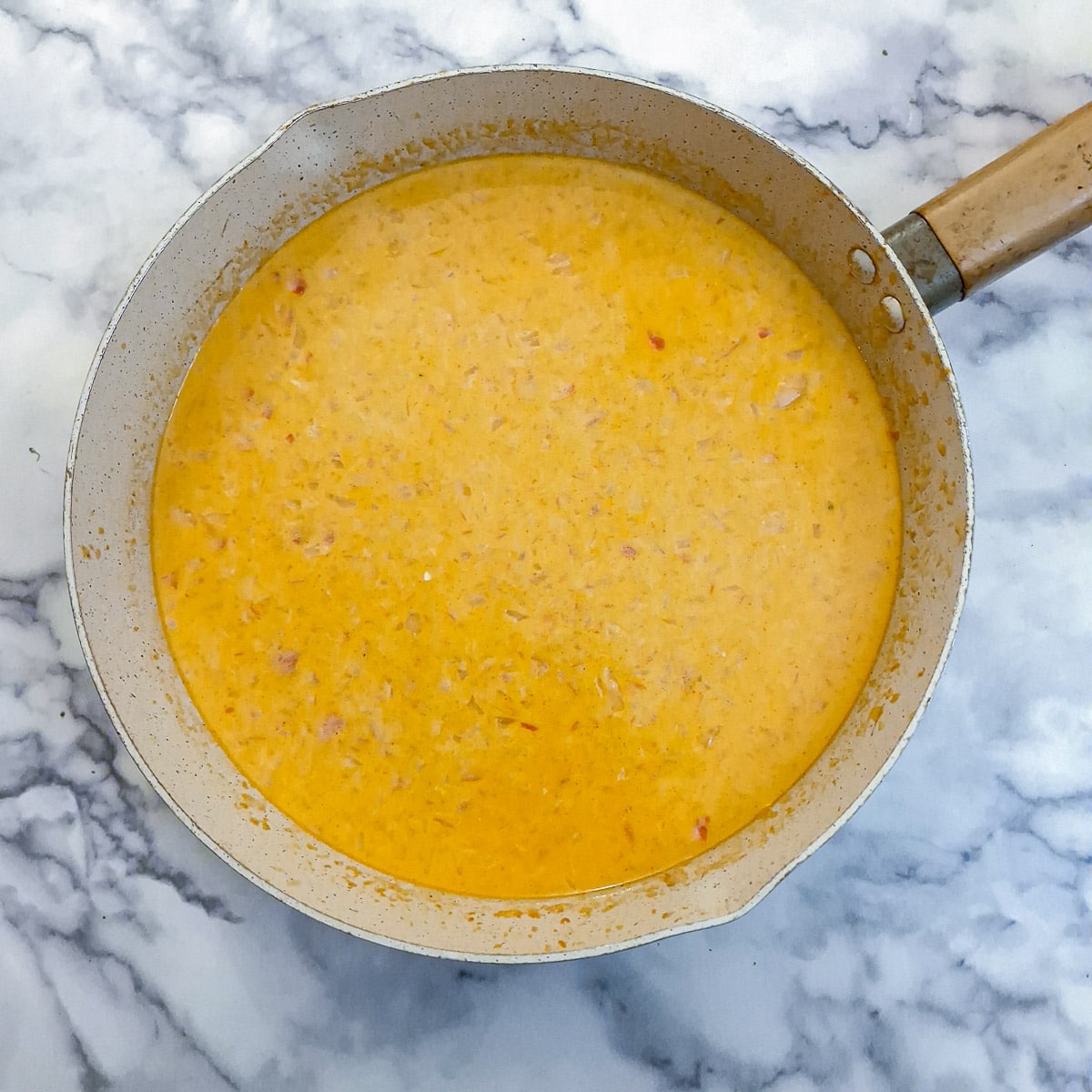 Cream and milk added to the red pepper sauce.