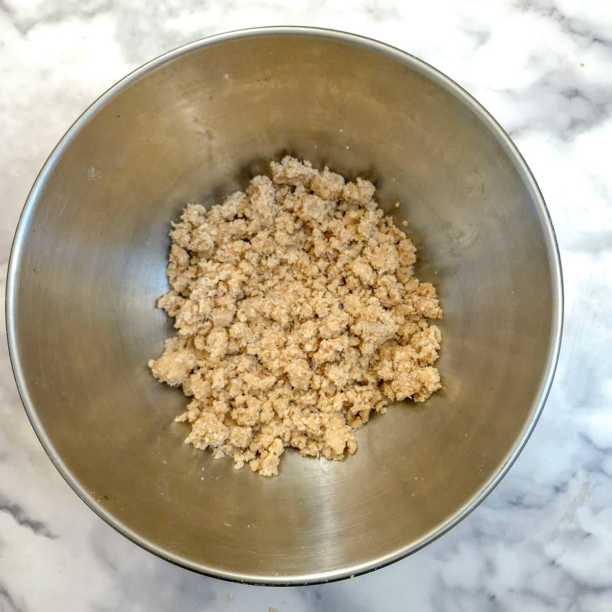 Flour, butter and sugar rubbed together to form buttery lumps.