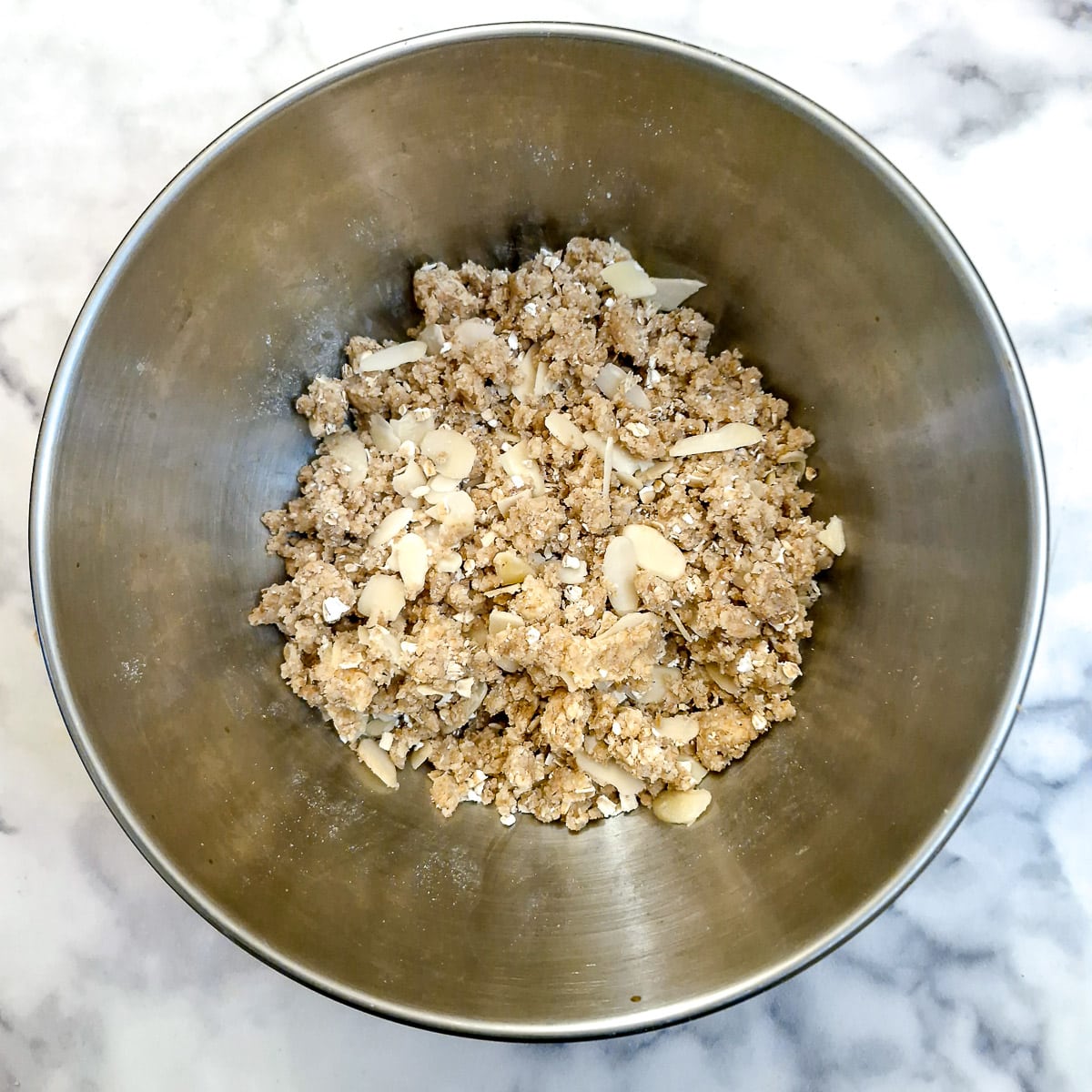 Oats and almonds combined with the flour and butter to form a crumble mixture.