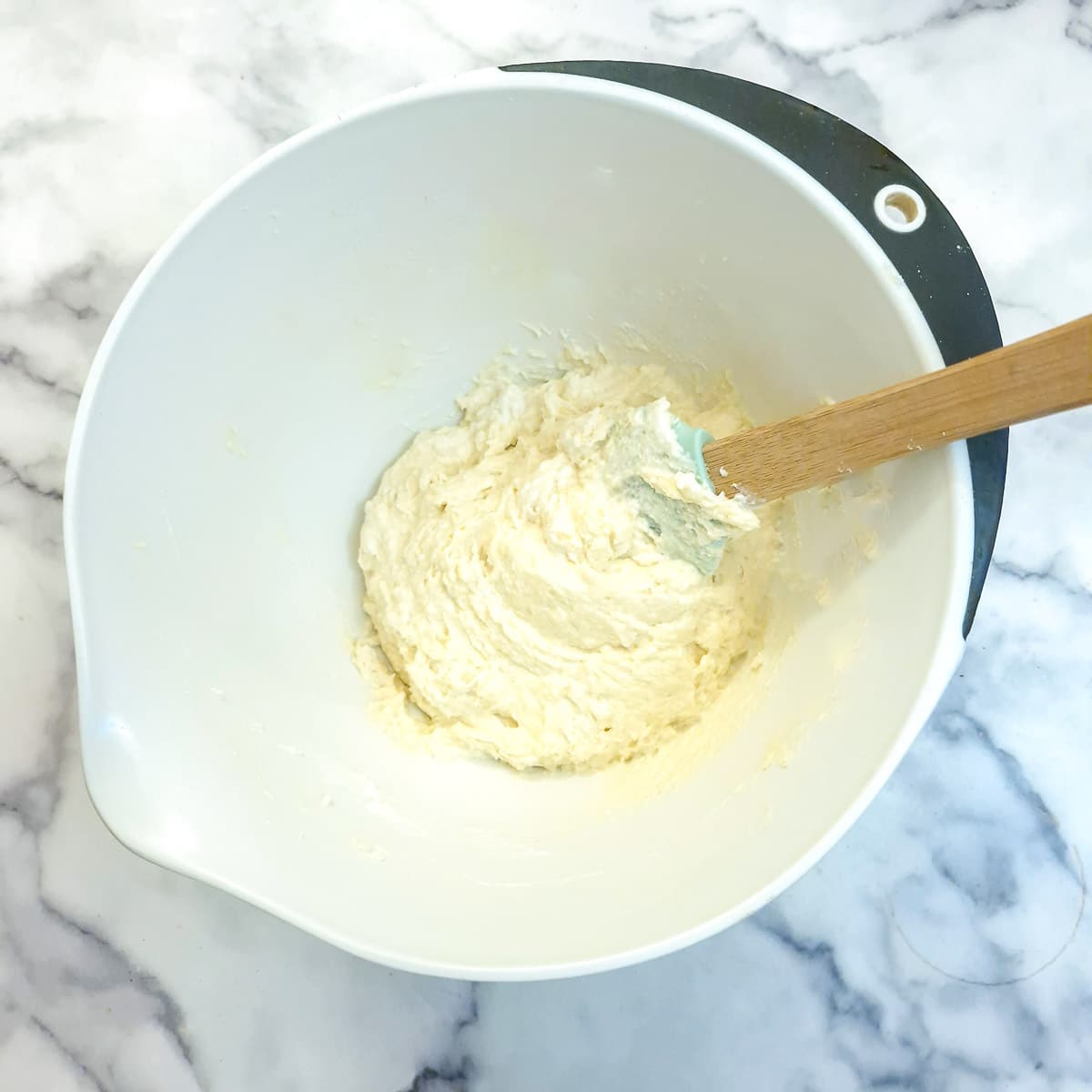 Flour and yoghurt combined into the blueberry cake batter.