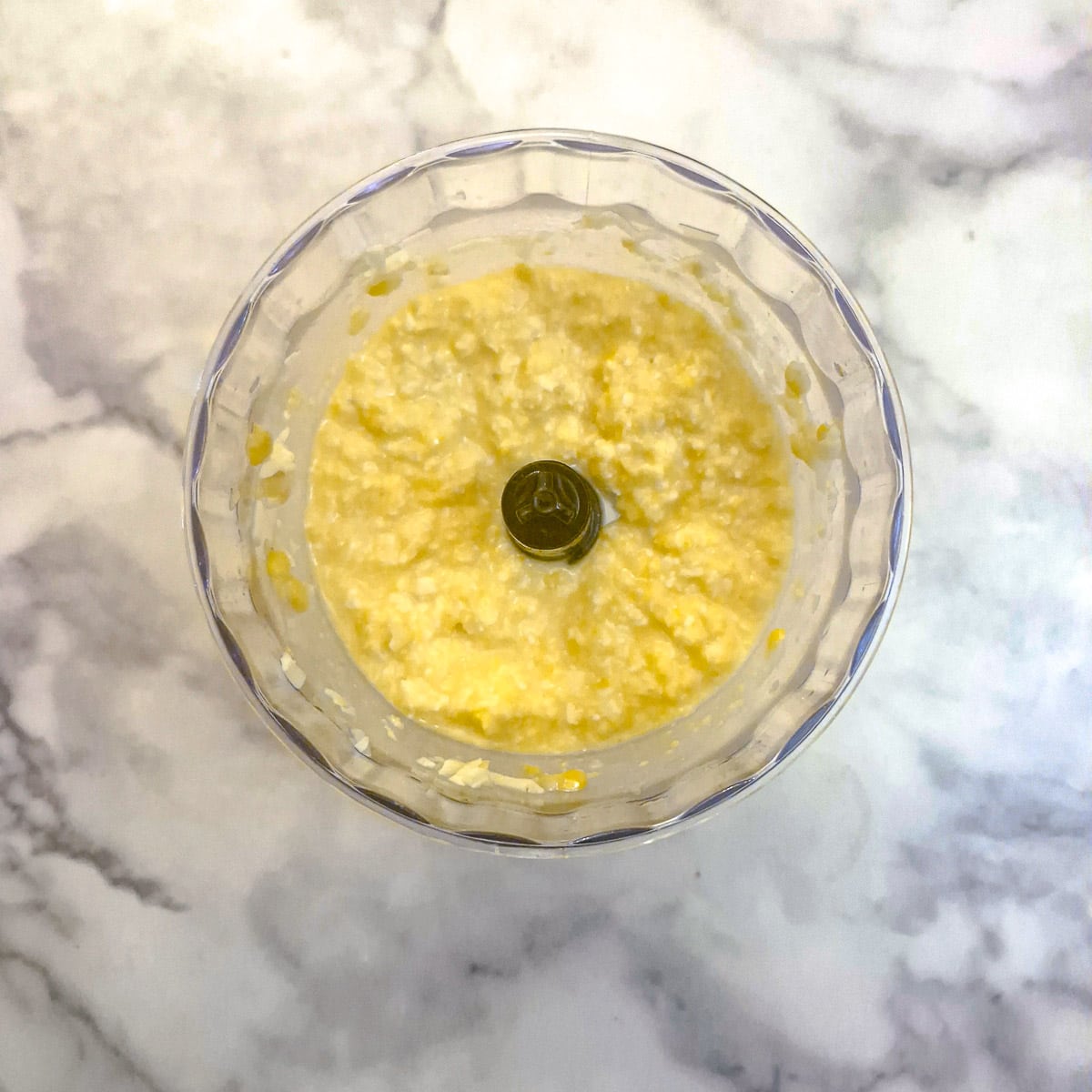 Eggs, corn and cheese combined in a food processor.