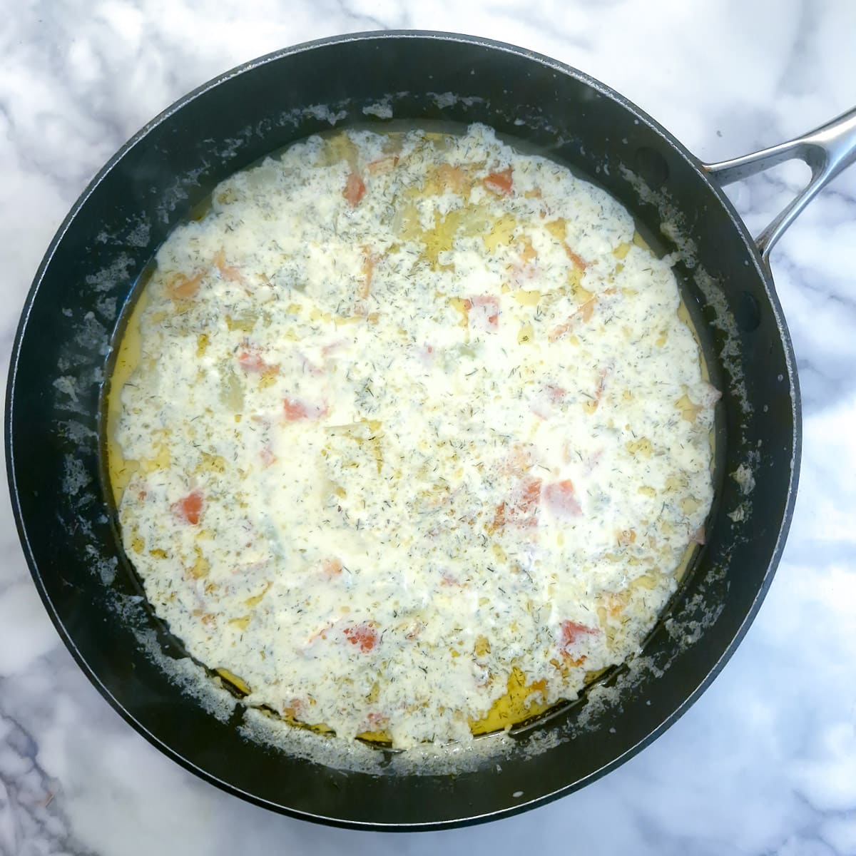 Cream and dill added to salmon chowder.