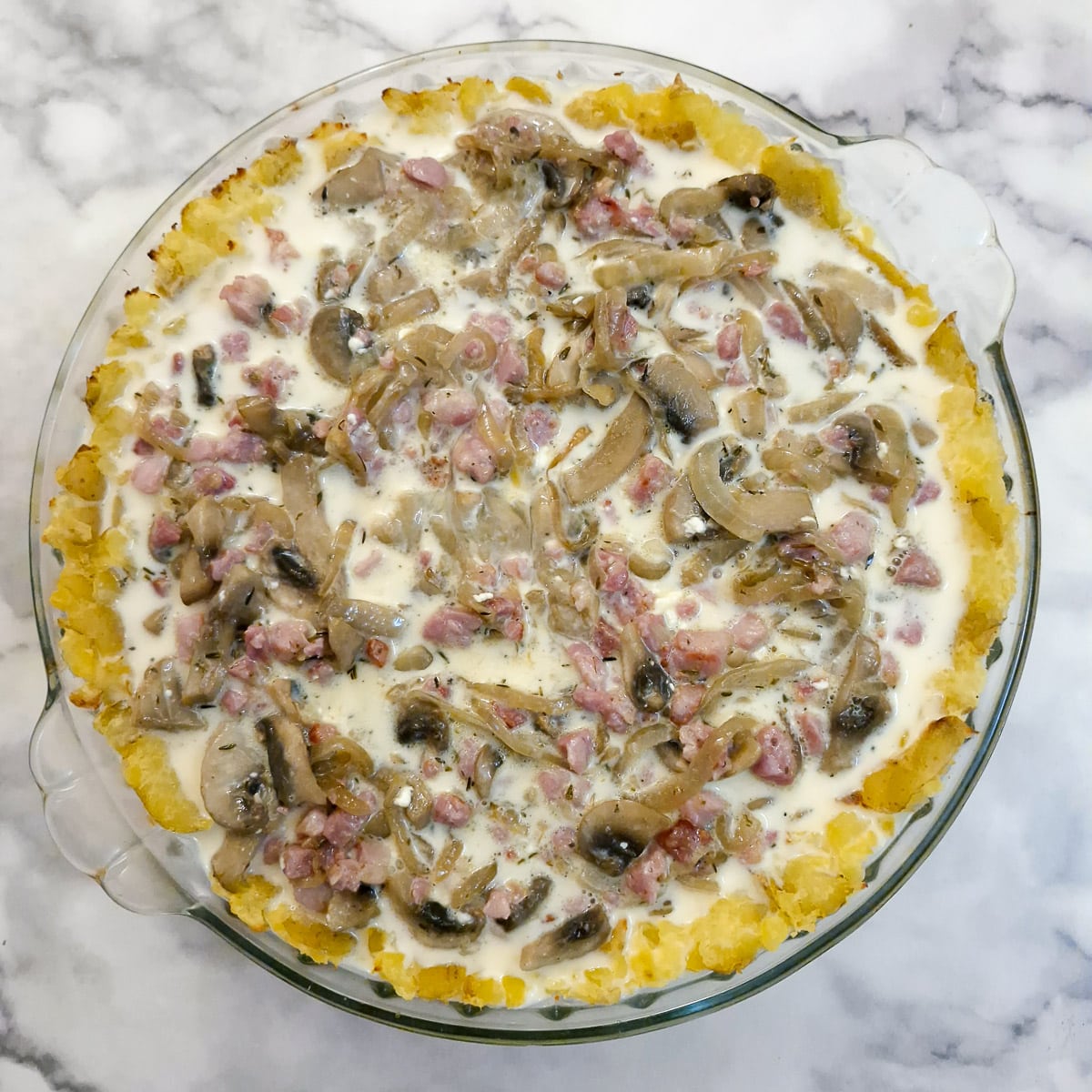 Egg and milk mixture poured over the quiche.