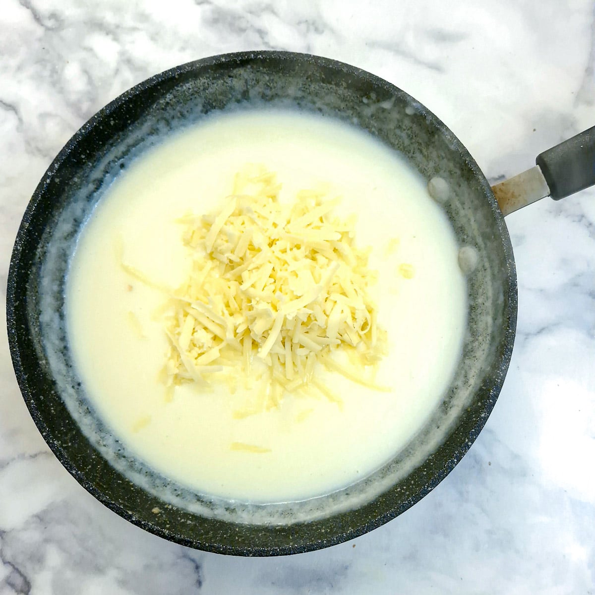 Grate cheese added to the bechamel sauce.