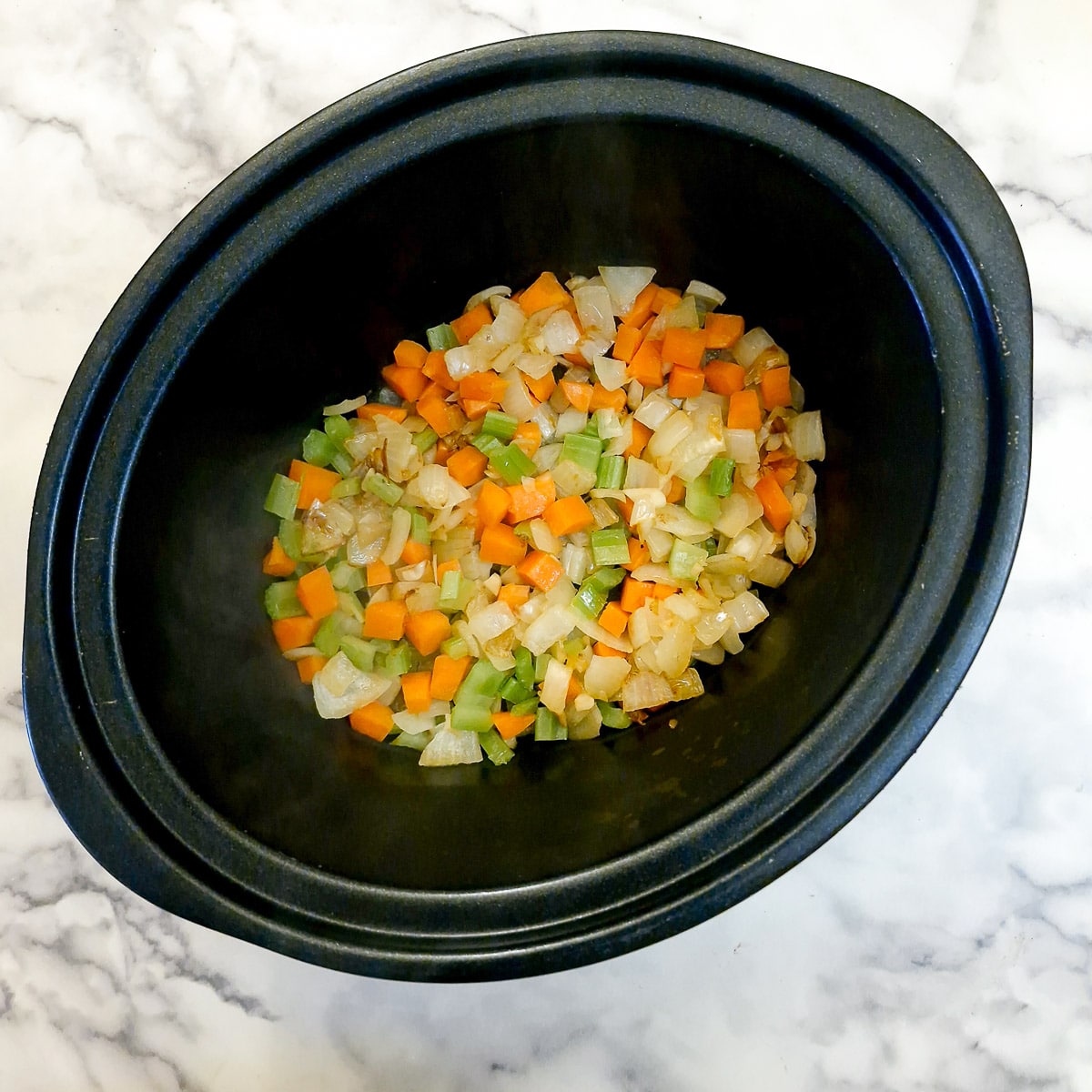 Softened vegetables in a slow cooker.