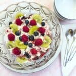 A glass serving dish filled with fruity Eton mess.