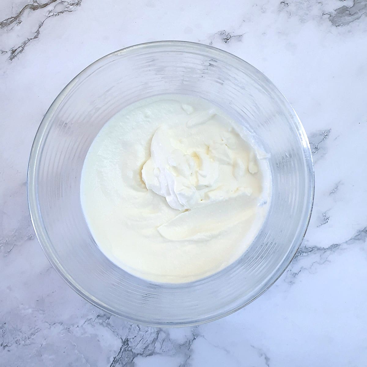 Whipped cream in a bowl.