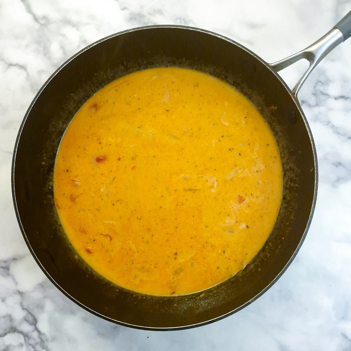 Coconut milk added to the sauce.
