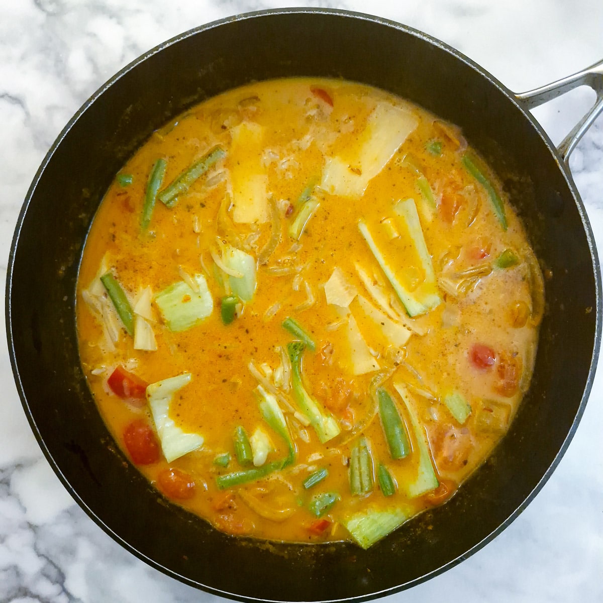 Vegetables added to the curry sauce.